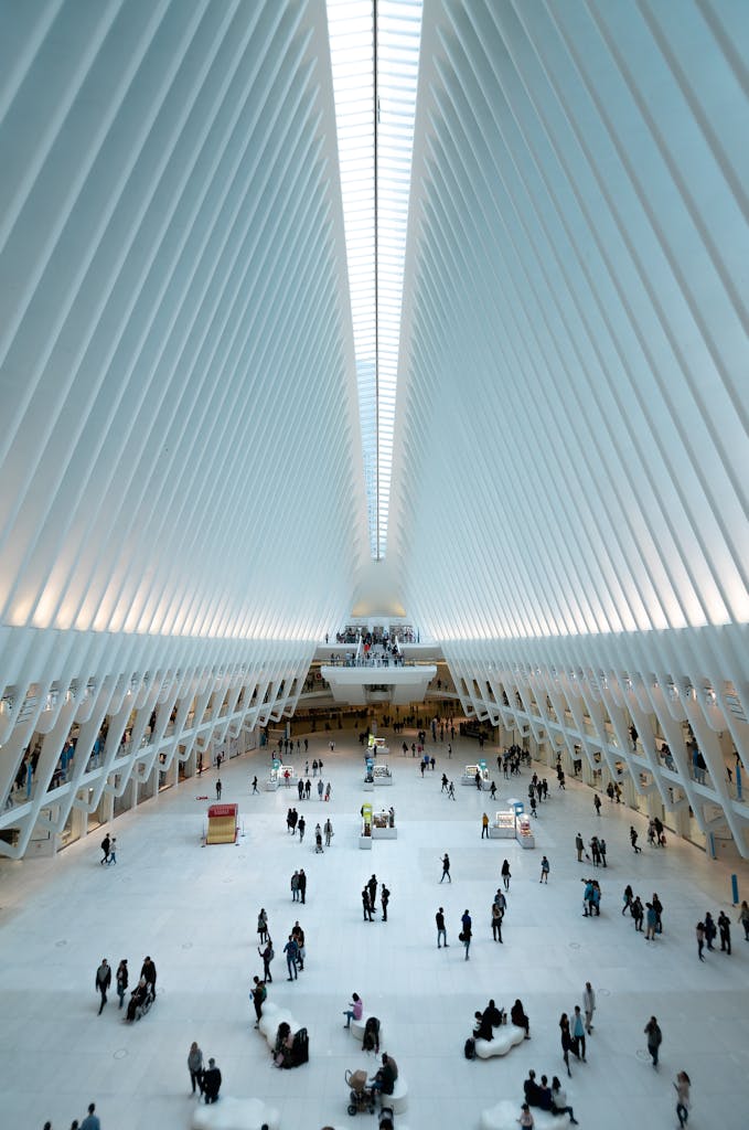 Modern architectural view of the Oculus in NYC, showcasing its futuristic design and bustling interior.
